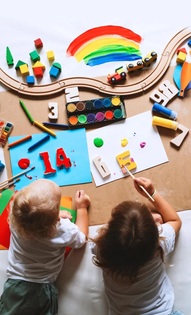 Happy toddlers playing with educational toys at Little Heaven daycare center