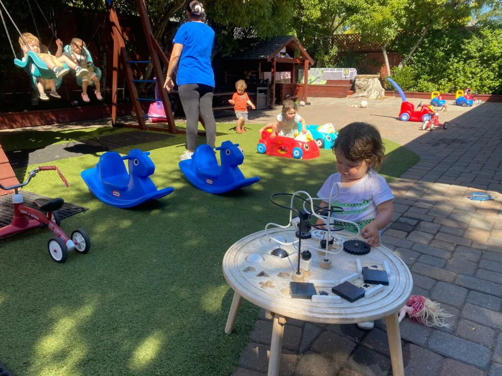 About Little Heaven Daycare staff and children engaged in learning activities in Corte Madera classroom